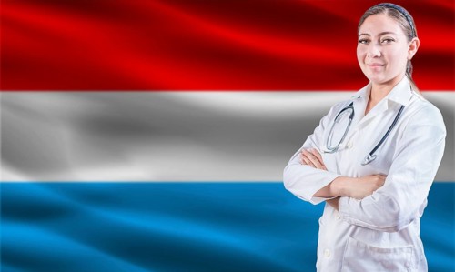 Female doctor on Luxembourg flag. Doctor with crossed arms on Luxembourg flag. Luxembourg health