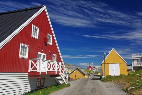 Colourful Scandinavian houses along a quiet street under a blue sky, old town of the capital of