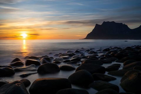 Seascape on the beach at Uttakleiv (Utakleiv), in the foreground round stones in the sea. In the