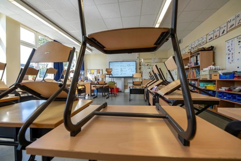 Classroom of a fourth grade, after school, the building is older but in good condition, modern
