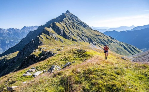Hiker on hiking trail, Carnic Main Ridge, Carnic High Trail, Carnic Alps, Carinthia, Austria,