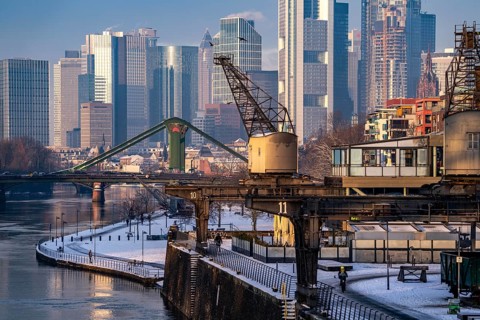 The skyline of Frankfurt am Main, skyscrapers of the banking district, historic harbour cranes at