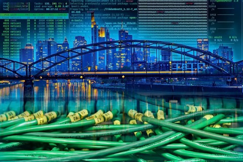 Symbolic image of critical infrastructure, skyline of Frankfurt am Main, data cable, hacker code