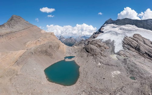 Panorama aerial view of glacial lake, SAC hut monte leone, near Simplon mountain pass, Switzerland,