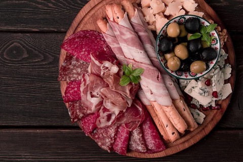 Appetizer, assortment, set, sausage, and cheese, on a wooden board, top view, no people
