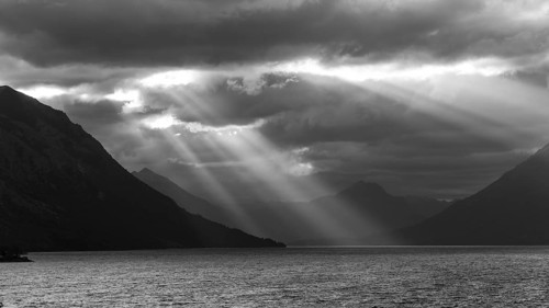 Black and white image of sunbeams and light mood at sunset at Lago Huechulafquen, Lanin National