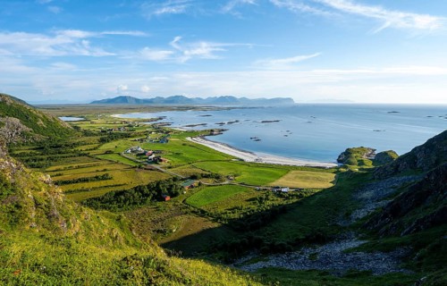 View of the coast with the village of Stave, beach and sea, hike to the summit of Måtind, Andøya