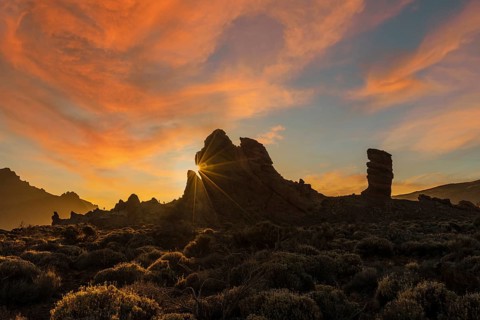 Sunset at Roque Cinchado next to Teide in the natural park of Tenerife, Canary Islands. Spain
