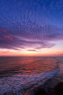 Ocean sunset on rocky coast. Varkala resort, Kerala, India, Asia