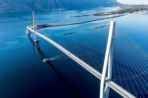 Aerial view of Helgeland bridge, connecting Sandnessjøen with the norwegian mainland, fishing boat