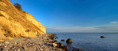Cliffs and boulders on the coast of the Baltic Sea in the evening light, Reddevitzer Höft, Mönchgut