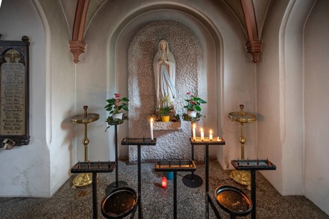 Marian altar with sacrificial candles in the neo-Gothic Basilica of Our Lady, built between 1892