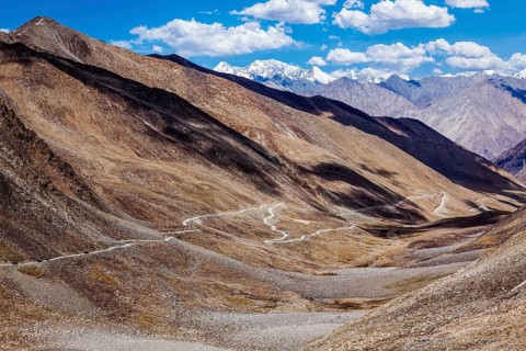 Himalayan valley landscape with road near Kunzum La pass, allegedly the highest motorable pass in