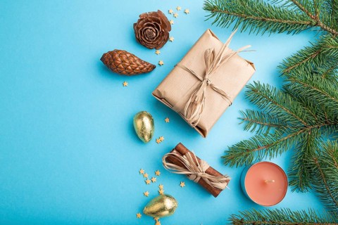 Christmas or New Year composition. Decorations, box, cinnamon, cones, fir and spruce branches, on a