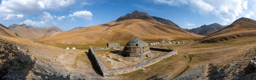 Historic caravanserai Tash Rabat from the 15th century, with yellow hills, Atbashy district in the