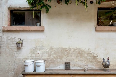 Two old enamel buckets and decorative objects on an old wooden bench, Alsace, France, Europe