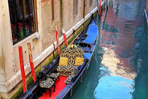 Luxury Gondola waiting for tourists near Rialto Bridge in Venice