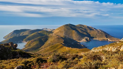 A clear picture of a bay with mountainous surroundings and blue sky on the coast, southern tip,