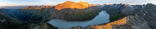 Alpine panorama with Pigne d'Arolla, Lac de Dix, sunset in the mountains, reservoir, Valais Alps,