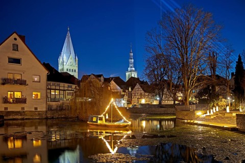 Large pond, St. Patrokli Cathedral and St. Peter's Church in the evening during winter sunshine,