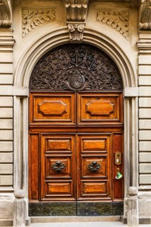Decorated arched entrance door, historic city centre, Lucca, Tuscany, Italy, Europe