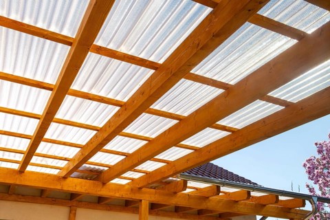 New patio roofing with wood and corrugated acrylic glass panels