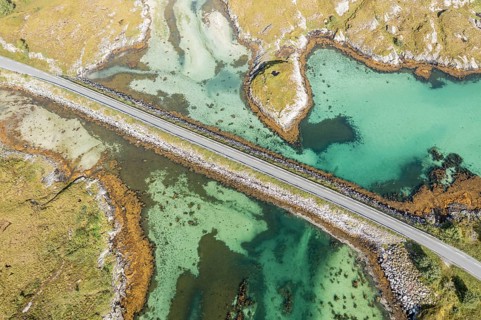 Aerial view of road on a dam connecting islands at the norwegian coast, Norway, Europe