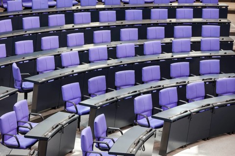 Empty plenary chamber in the German Bundestag, equipped with office swivel chairs in the special