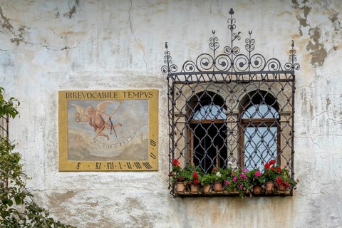 Sundial on a weathered house facade, Kaltern, South Tyrol, Italy, Europe
