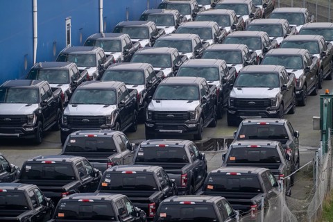 Ford FX4 pickup trucks on stockpile, in the overseas harbour of Bremerhaven, after import from the