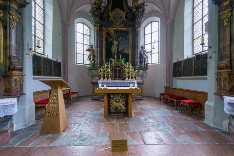 Parish church of St Sebastian with richly decorated altar, statues of saints and paintings, framed