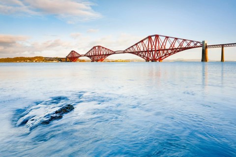 View of the red railway bridge Forth Bridge at the Fírth of Forth estuary near South Queensferry,