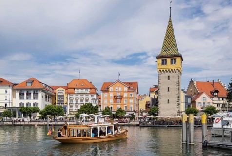 Harbour of Lindau, town view with man tower from excursion boat. Lindau, Lake Constance, Bavaria,