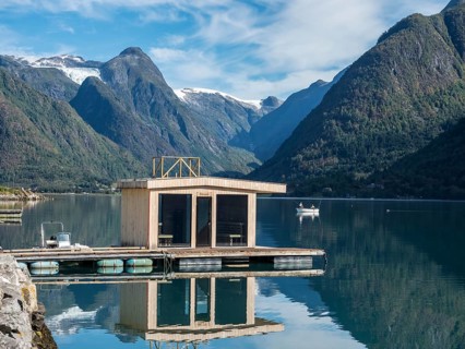 Floating sauna, village Fjaerland at the Sognefjord, glacier Jostedalsbre in the back, Norway,