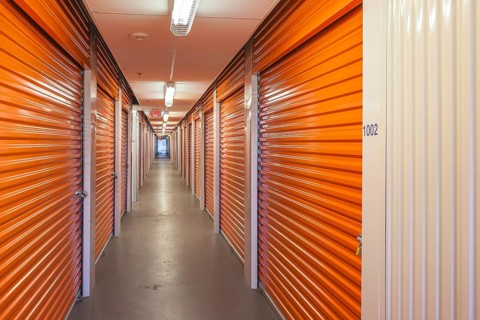 Orange interior of self storage rental units at an enclosed mini warehouse facility in Gulfport,