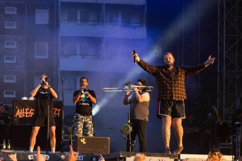 Monchi (Jan Gorkow, right), singer of Feine Sahne Fischfilet and members of the band Panteon