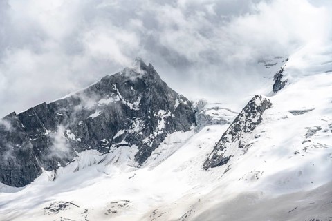 Mountain landscape of rock and ice, rocky peak between glacial ice on the Waxeggkees glacier,