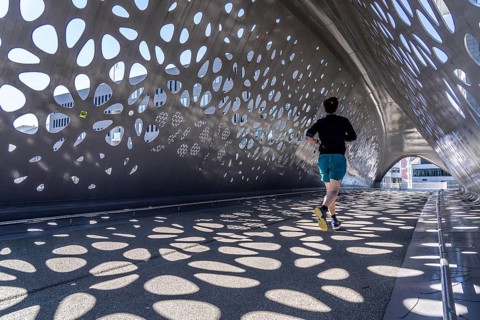 Light effects from the sun in the Parkbruk, a cycle and pedestrian bridge in the city centre of