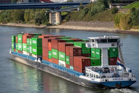 The Dutch cargo ship Vrido, loaded with containers, on the Rhine near Duisburg, downstream, North