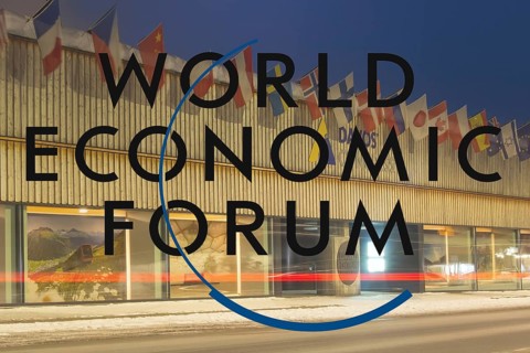 Logo of the WEF (World Economic Forum), in the background the Davos Congress Centre