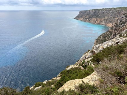 View of the rocky coast at the Far de la Mola lighthouse, eastern tip of Formentera, Balearic