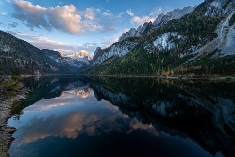 The Vordere Gosausee lake in autumn with a view of the Dachstein mountain range. The Gosaukamm on