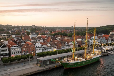 Bark Alexander von Humboldt II and the old town centre of the Baltic Sea resort of Travemünde, Bay