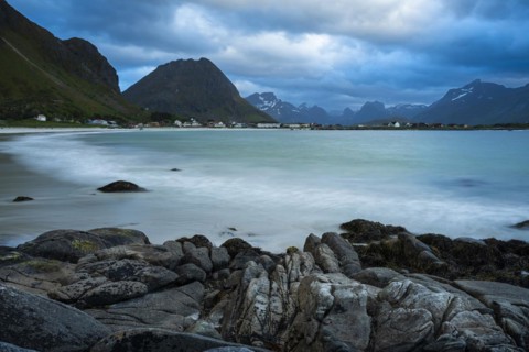 Landscape on the Lofoten Islands. The village of Ramberg, with rocks and sea and the sandy beach