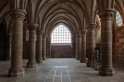 Gothic room with high columns and large windows, majestic, Le Mont-Saint-Michel