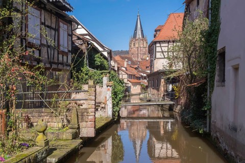 Lauter-Viertel le Schlupf with the tower of the church of St Peter and Paul, Wissembourg, Alsace,