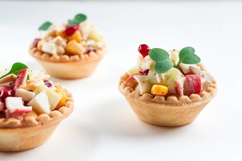 Canapes with salad, corn with crab sticks, appetizer, portioned, close-up, no people