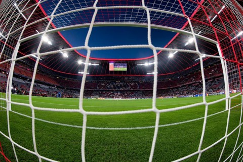 Overview, interior, floodlit match, behind-the-goal perspective, goal net, blue hour, fisheye shot,