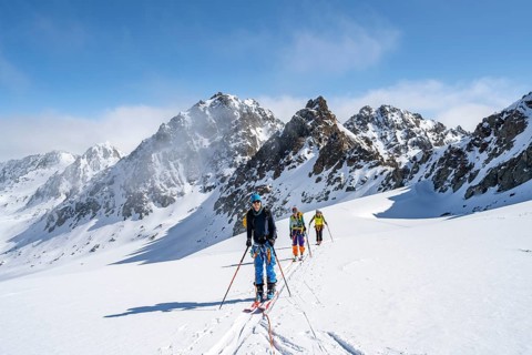 Ski tourer with rope, rope team on the Vadret da Porchabella glacier on the ascent to the summit of