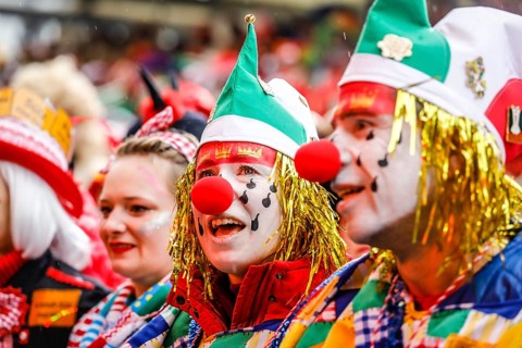 Colourfully costumed carnivalists celebrate carnival in Cologne, on Weiberfastnacht the street